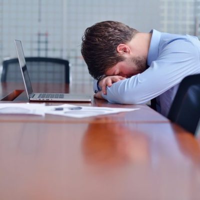 man-sleeping-at-desk